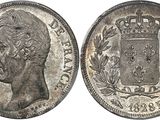 a silver coin with a crown on the front and a crown on the back
