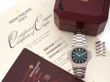 an image of a rolex watch sitting on top of a table next to a certificate