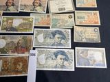 several different types of bank notes on a table with a price tag