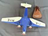 a blue and white model of a plane on a table