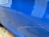 a close up of a blue car that has been painted