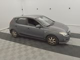 a picture of a small car parked in a garage