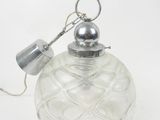 an image of a clear glass christmas ornament with a metal handle