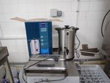 an image of a kitchen with a lot of items on the counter