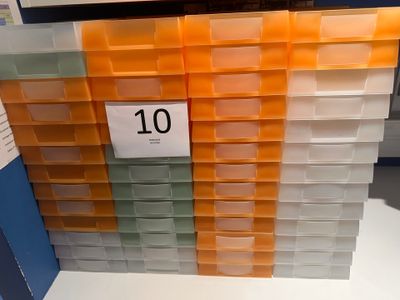 a lot of plastic bins that are on the shelf