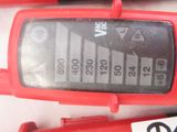 a close up of a red cell phone with a number on it