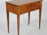 a small wooden table with two drawers on it