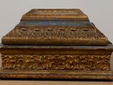 a gold and blue box sitting on a table
