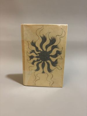a small box with a drawing of a flower on it