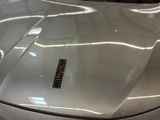 a close up of a car hood with a sticker on it
