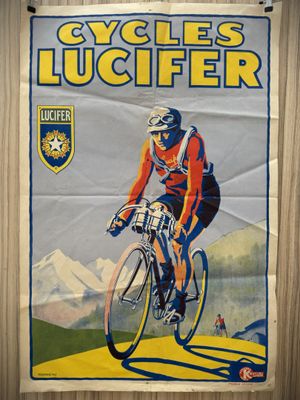 poster of a man riding a bike on a wooden surface
