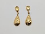 a pair of gold tone earrings with a tear shaped drop