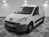 a small white van parked in a room with checkered floor