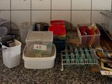 a picture of a kitchen with a lot of clutter on the counter