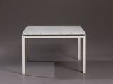 a white table with a marble top on a grey surface