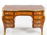 a small desk with a marble top on it