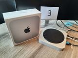 an image of a white box with an apple logo on it next to a computer monitor