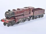 a toy train on a white surface with a white background
