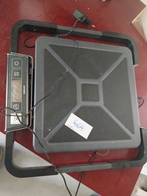 a black box sitting on top of a red table