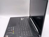 a black laptop with a black keyboard on a white surface