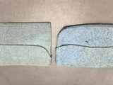 two pieces of cloth sitting on top of a table