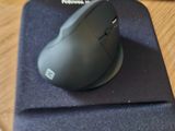 a mouse sitting on top of a mouse pad on a desk