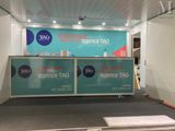 a photo of a booth with a sign on the wall