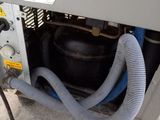 a machine that has a hose attached to the back of it