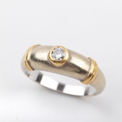 a close up of a ring with a diamond on top of it