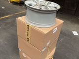 a stack of boxes with a wheel on top of it
