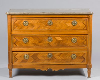 an antique chest of drawers with marble top