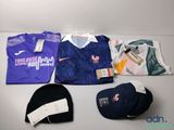 a lot of clothing and a hat on a table