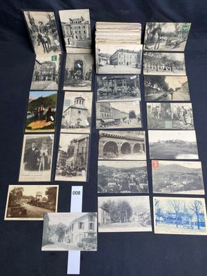 an old photo of a bunch of old postcards sitting on top of a table