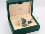 a watch in a box with a key in it