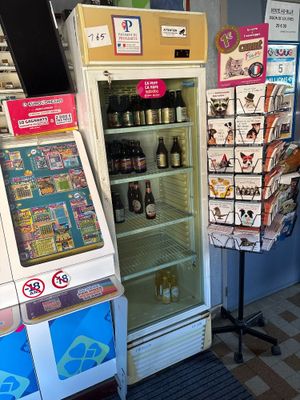 a display of beer bottles and other beverages in a store