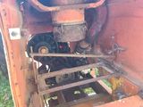 a rusted out old truck with a rusted out engine