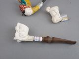 a pipe, a pipe holder and a pipe holder on a table