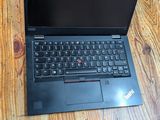 a laptop computer sitting on top of a wooden table