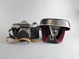 two cameras sitting next to each other on a table