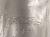 a close up of a silver vase on a table