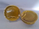 two yellow plates with a moustache on them sitting next to each other