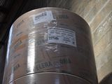 a large roll of plastic wrapped up in a warehouse