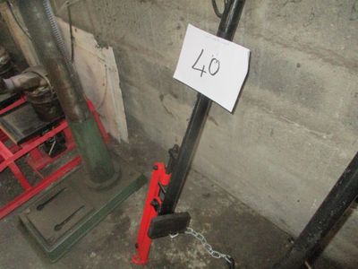 a picture of a number sign on a pole in a basement