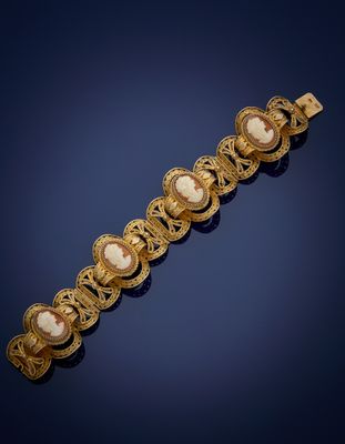 a gold bracelet with cameo cameos and filigrees