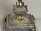 an antique silver plated candle holder with a lion on the base