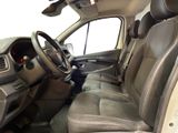 a view of the inside of a car from the driver ' s seat