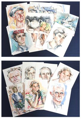 many cards of different people on a table