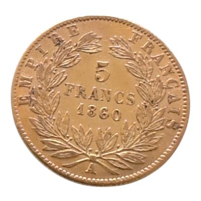 une image représentant une pièce d'or ornée d'une couronne de feuilles