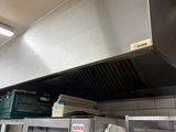 a kitchen with a stove and oven in it