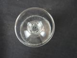 overhead view of a glass of water on a black surface